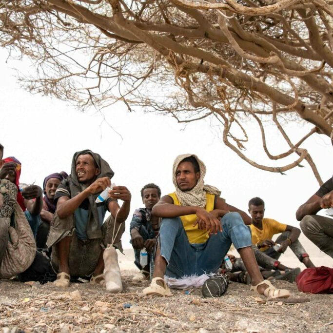 Djibouti, Obock, 2022-06-21. IOM s Mobile unit rescue 109 stranded migrants in the desert. A migrant is eating biscuits given by IOM with the help of WFP. Photograph by Alexander BEE / Hans Lucas.