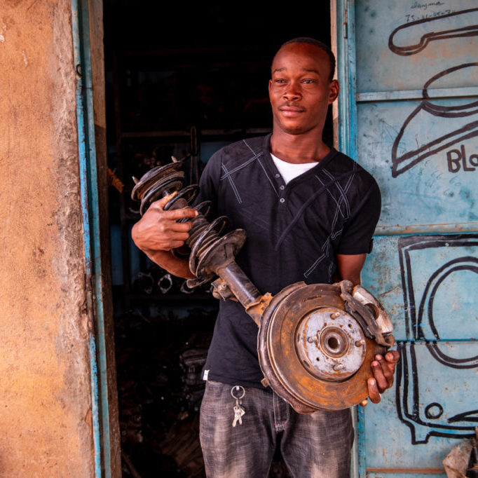 April 2021, Ouagadougou, Burkina Faso. Portrait of Lemani Arzouma holding car spare parts